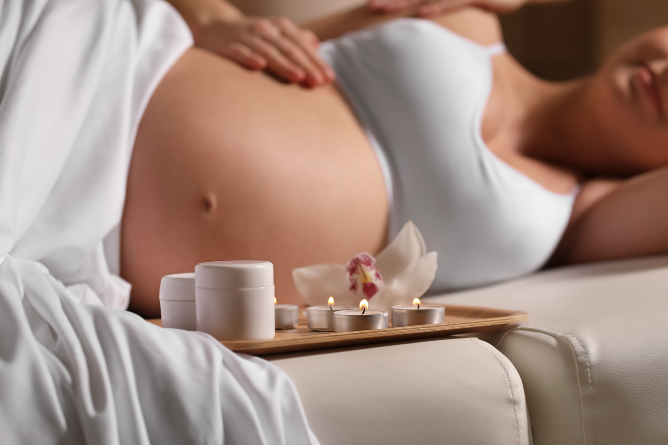 Pregnant Woman Having Massage in Spa Salon